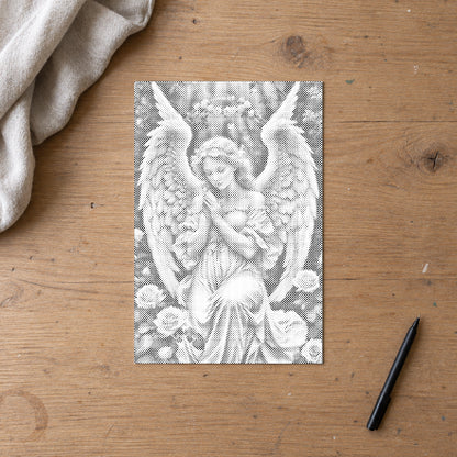 Toile de peinture par points “Ange aux roses délicates”, posée sur une table en chêne près d’un feutre noir.