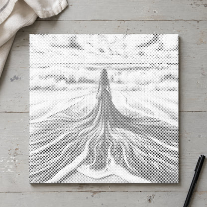 Toile de peinture par points “Entre ciel et mer”, vue du dessus sur une table de travail à la lumière douce du jour.