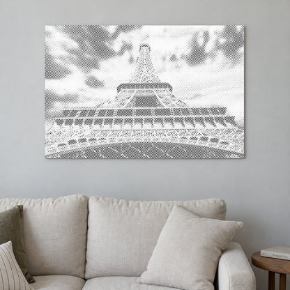 Toile de peinture par points “Tour Eiffel”, sur un mur clair dans une pièce baignée d’une lumière douce.