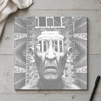 Toile de peinture par points “Homme impressionnant”, vue du dessus sur une table de travail à la lumière douce du jour.