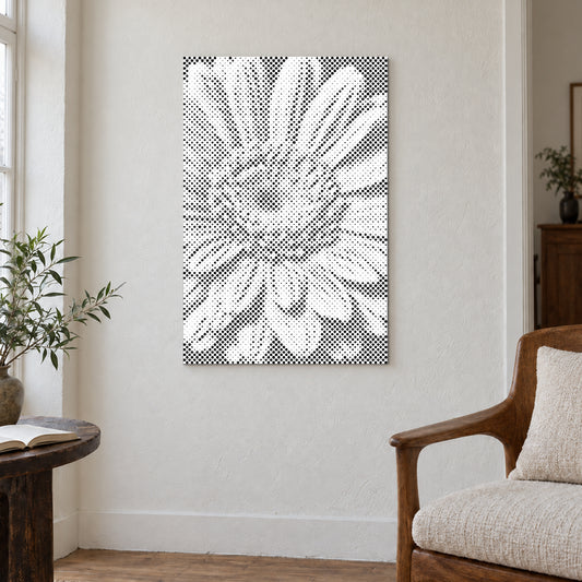 Toile de peinture par points “Fleur de gerbera”, sur un mur clair dans une pièce baignée d’une lumière douce.