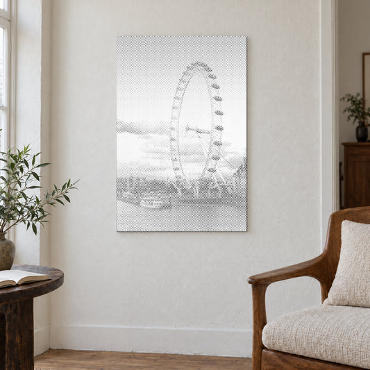 Toile de peinture par points “London Eye”, sur un mur clair dans une pièce baignée d’une lumière douce.