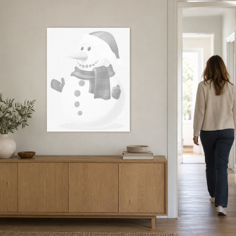 Toile de peinture par points “Bonhomme de neige”, sur un mur clair, avec une personne passant par la porte voisine.